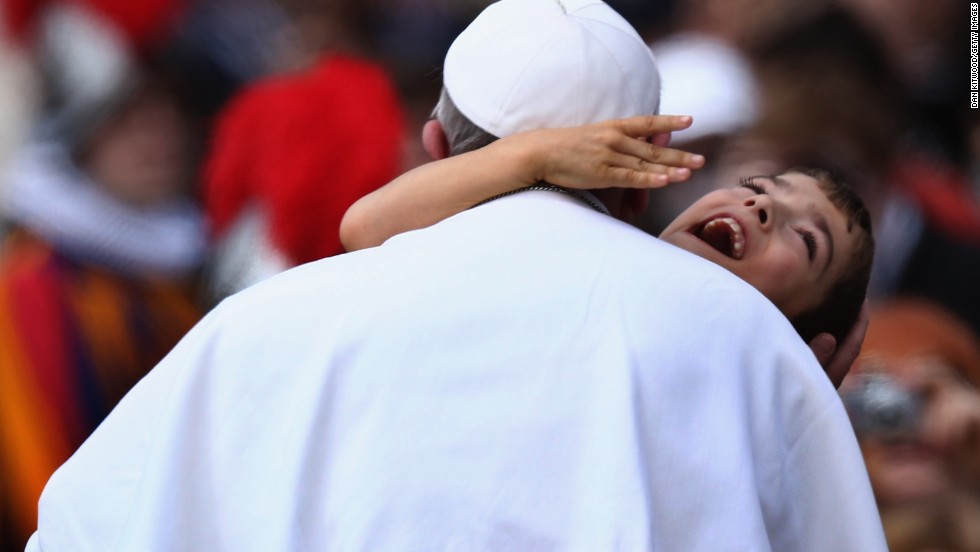 Francis embraces a young boy with cerebral palsy in March 2013 -- a gesture that many took as a heartwarming token of the Pope's self-stated desire to "be close to the people."