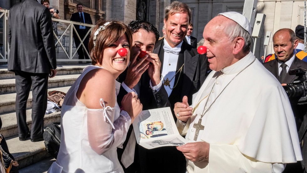 Pope Francis jokes in November 2013 with members of the Rainbow Association, which uses clown therapy in hospitals, nursing homes and orphanages.