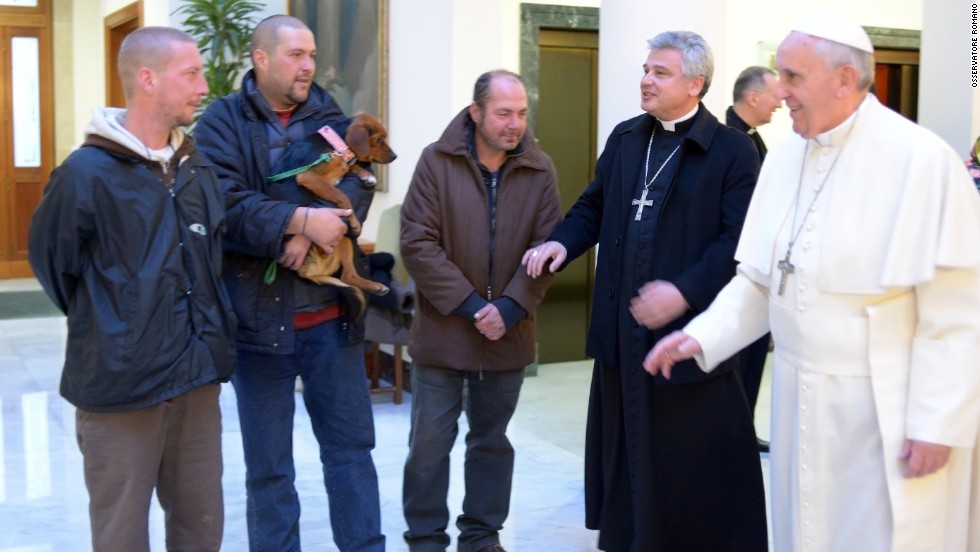 Pope Francis marked his 77th birthday in December 2013 by hosting homeless men to a Mass and a meal at the Vatican. One of the men brought his dog. 