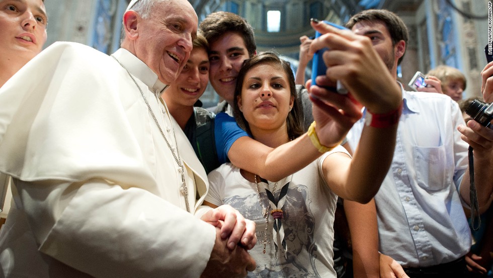 Francis has his picture taken inside St. Peter's Basilica with youths who came to Rome for a pilgrimage in August 2013.