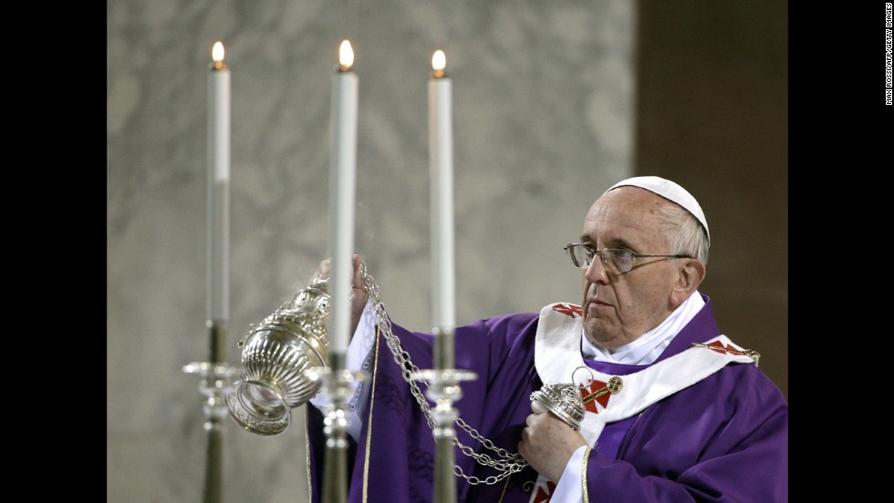 The Pope blesses the altar at Rome's Santa Sabina church as he celebrates Mass on Ash Wednesday in March 2014.