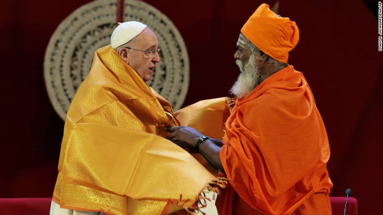 Hindu priest Kurakkal SivaSri T. Mahadeva presents a shawl to Pope Francis in Colombo, Sri Lanka, on Tuesday, January 13.