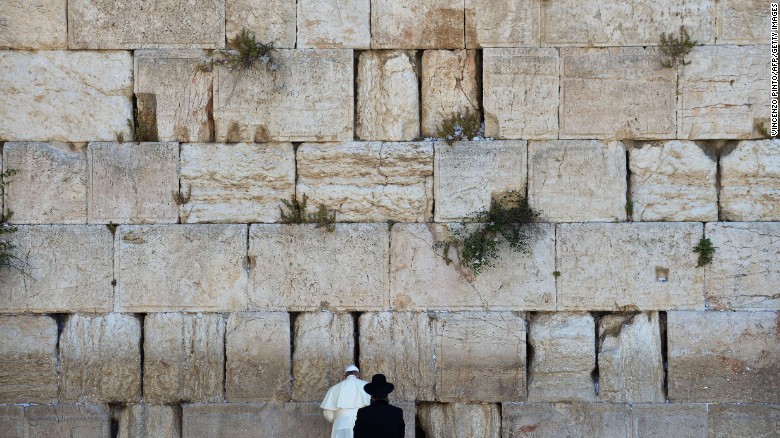 Pope Francis prays next to a rabbi at the Western Wall in Jerusalem's Old City in May 2014. The Pope went on a <a href="http://www.cnn.com/2014/05/24/world/gallery/pope-holy-land/index.html">three-day trip to the Holy Land</a>, and he was accompanied by Jewish and Muslim leaders from his home country of Argentina.
