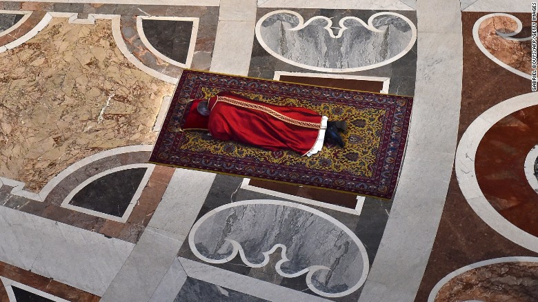 The Pope prays face down on the floor of St. Peter's Basilica during Good Friday celebrations at the Vatican on Friday, April 3.