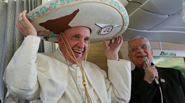 Pope Francis tries on a traditional sombrero he received as a gift from a Mexican journalist on Friday, February 12, aboard a plane during his flight from Rome to Habana, Cuba. The voyage kicks off his week-long trip to Mexico. With his penchant for crowd-pleasing and spontaneous acts of compassion, Pope Francis has earned high praise from fellow Catholics and others since he replaced Pope Benedict XVI in March 2013.